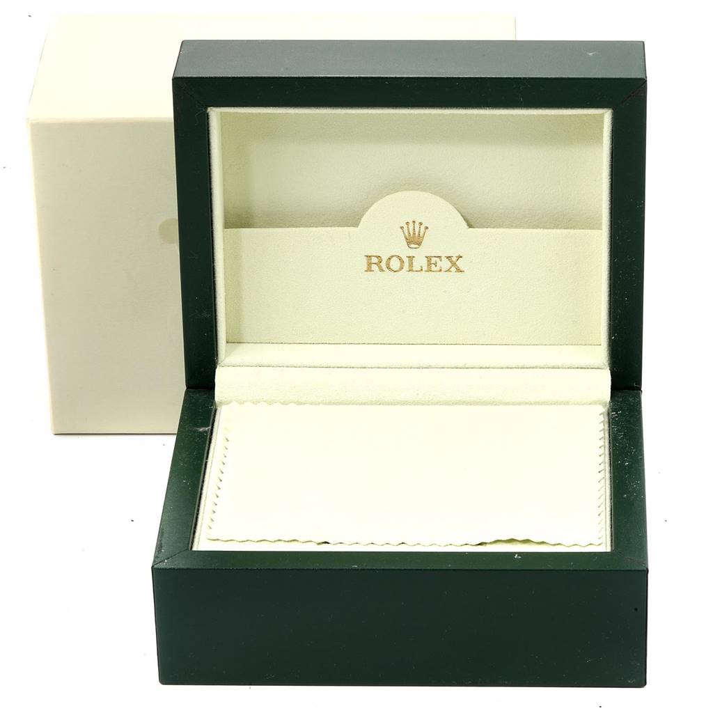 The image shows an empty green Rolex box for a GMT-Master model, with its lid open, exposing the inner lining and the Rolex logo.