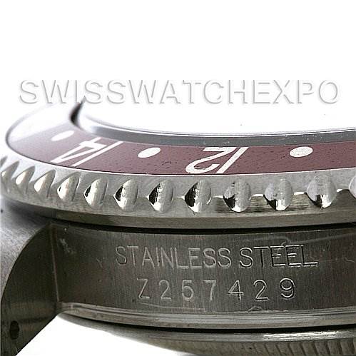 The image shows a side angle of a Rolex GMT-Master 16710 Men's Stainless Steel Black Dial 16710 Men's Stainless Steel Black Dial with focus on the bezel, case, and serial number engraving.