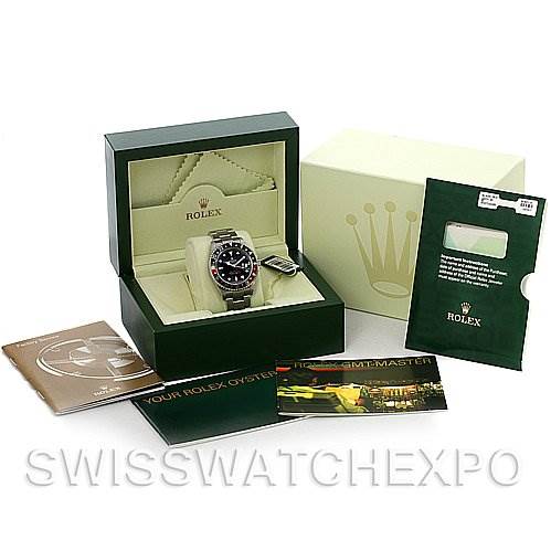 The image shows a Rolex GMT-Master 16710 Men's Stainless Steel Black Dial 16710 Men's Stainless Steel Black Dial watch at a slight angle, along with its box, papers, and accessories.