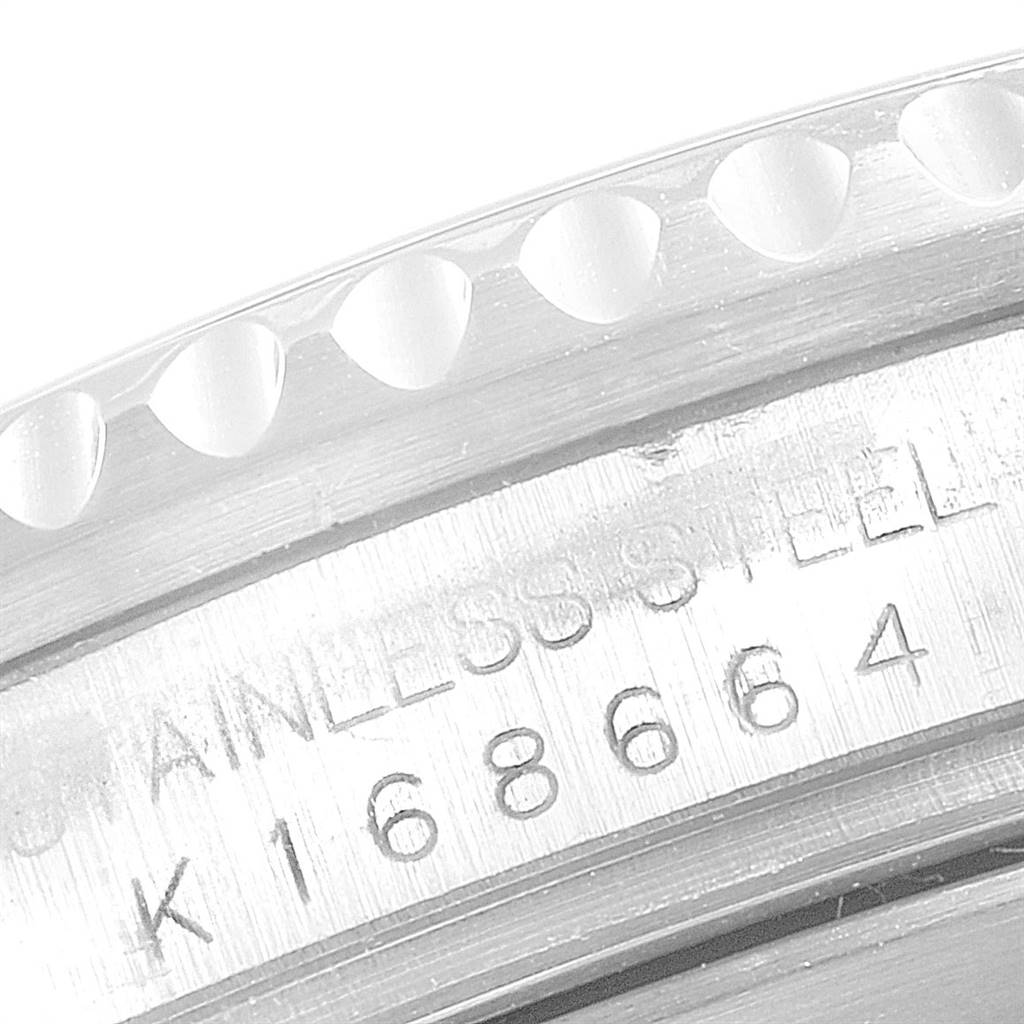 The image shows a close-up of the case back and serial number of a Rolex GMT-Master 16710 Men
s Stainless Steel Black Dial 16710 Men
s Stainless Steel Black Dial watch, focusing on its stainless steel detail.