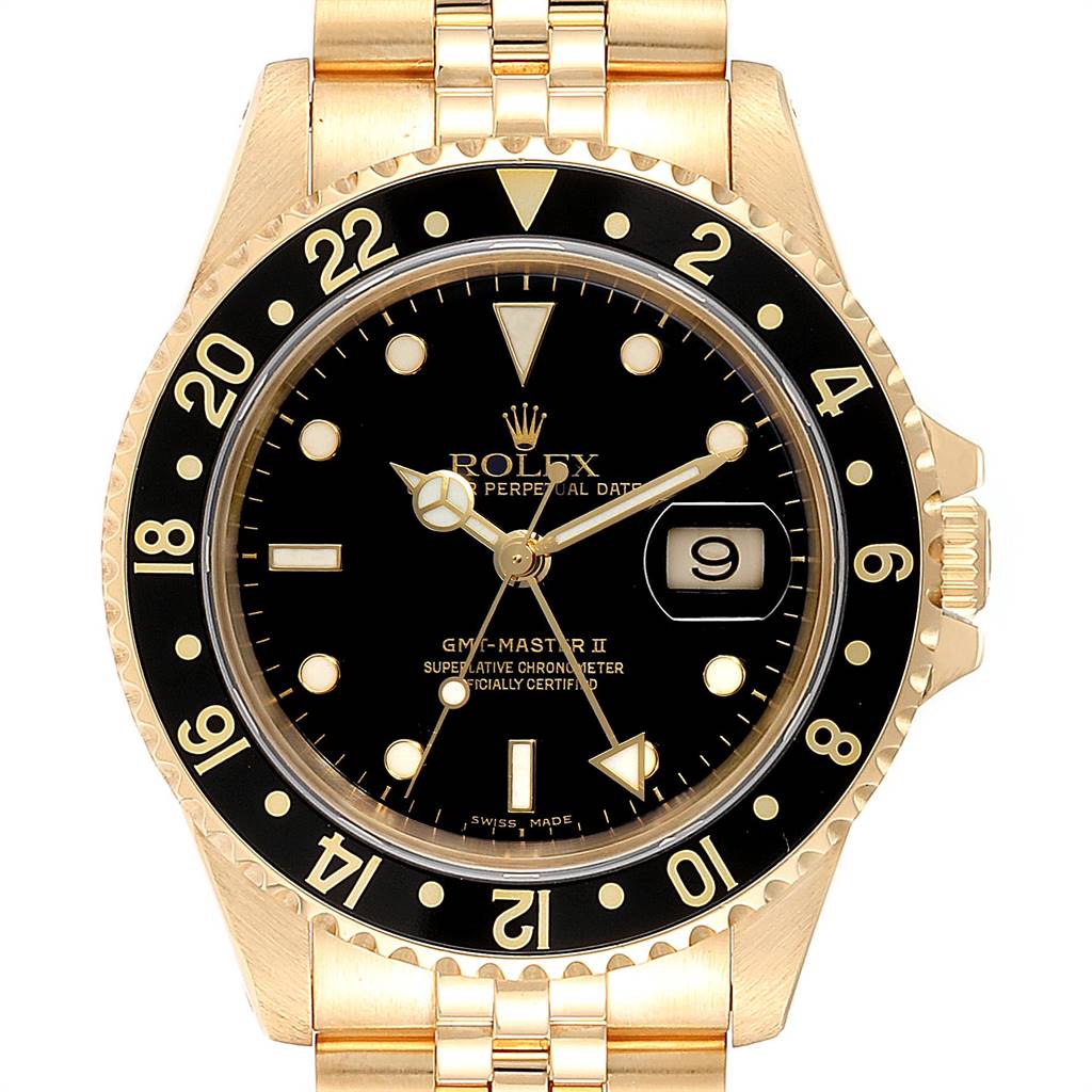 The image shows a front view of the Rolex GMT-Master 16718 Men's Yellow Gold Black Dial 16718 Men's Yellow Gold Black Dial II watch, highlighting the dial, bezel, and part of the bracelet.