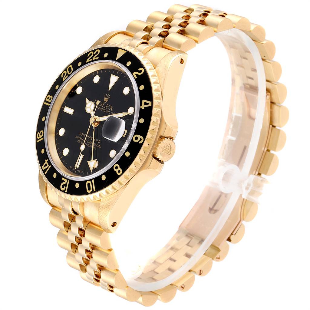 The watch is a Rolex GMT-Master 16718 Men's Yellow Gold Black Dial 16718 Men's Yellow Gold Black Dial model shown from a side angle highlighting its bezel, dial, crown, and bracelet.