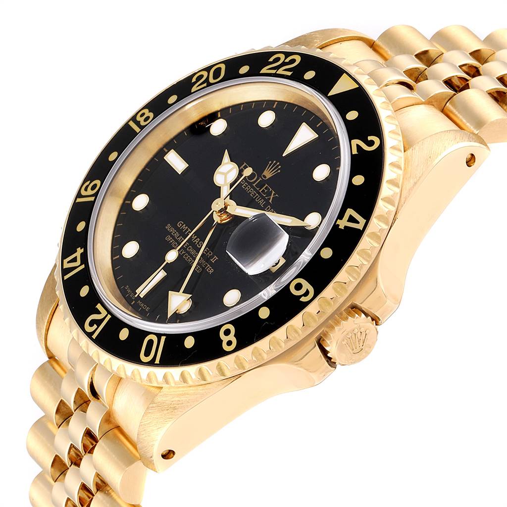The image shows a close-up angled view of a gold Rolex GMT-Master 16718 Men's Yellow Gold Black Dial 16718 Men's Yellow Gold Black Dial watch, highlighting the face, bezel, crown, and part of the bracelet.