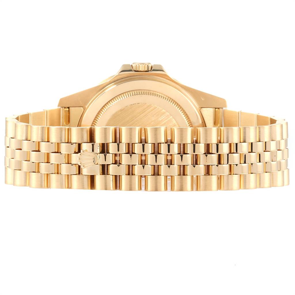 The image shows the back view of the Rolex GMT-Master 16718 Men's Yellow Gold Black Dial 16718 Men's Yellow Gold Black Dial watch, highlighting the case back and the gold Jubilee bracelet.