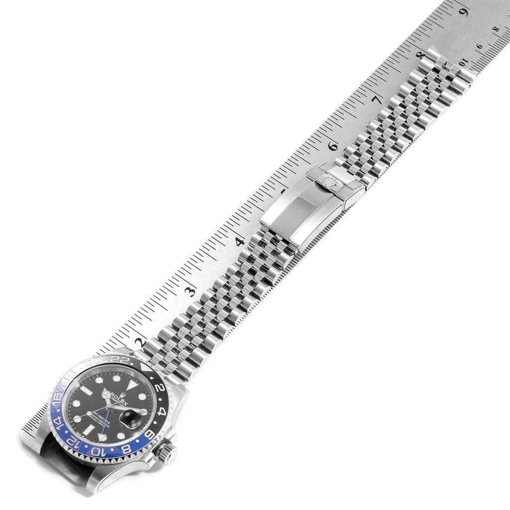 This image shows a Rolex GMT-Master 126710 Men's Stainless Steel Black Dial 126710 Men's Stainless Steel Black Dial watch laid flat, with the face and bracelet visible, aligned with a ruler.