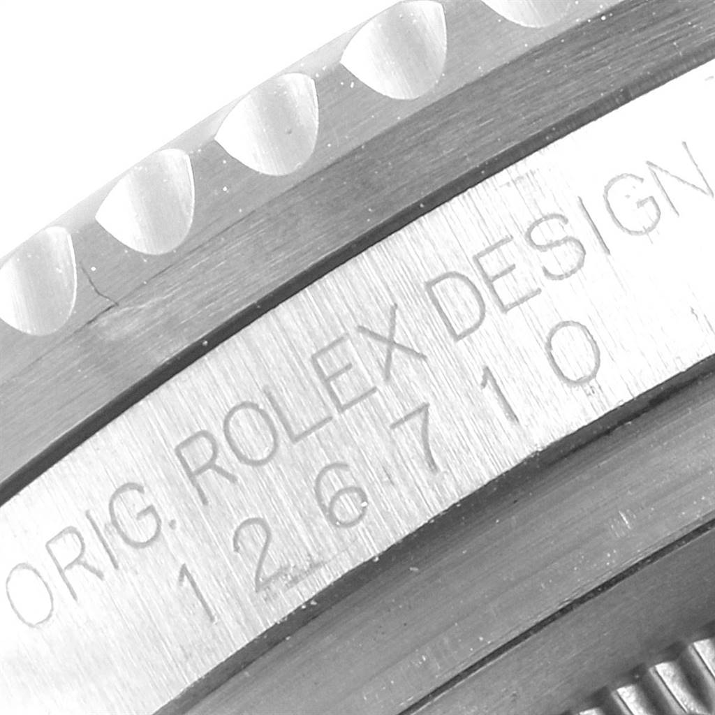 The image shows a close-up of the engraved bezel and case side of the Rolex GMT-Master 126710 Men's Stainless Steel Black Dial 126710 Men's Stainless Steel Black Dial watch.