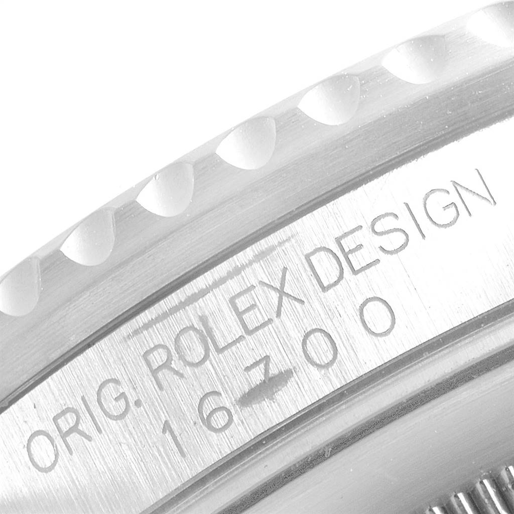 The image shows a close-up of the bezel and case side of a Rolex GMT-Master 16700 Men's Stainless Steel Black Dial 16700 Men's Stainless Steel Black Dial watch, highlighting the model number 16700.