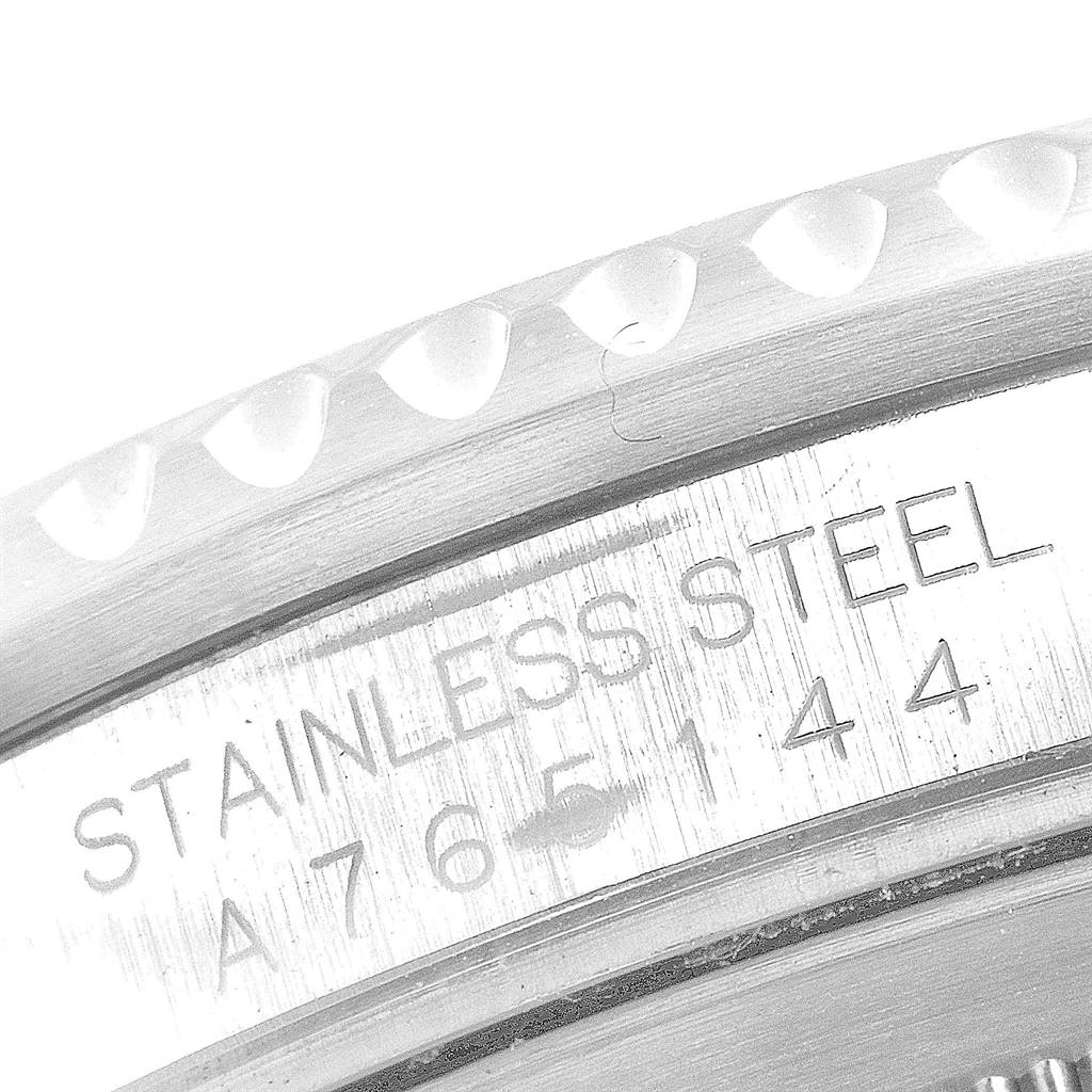 This is a close-up view of the stainless steel part and serial number etched on the side of a Rolex GMT-Master 16700 Men's Stainless Steel Black Dial 16700 Men's Stainless Steel Black Dial watch.