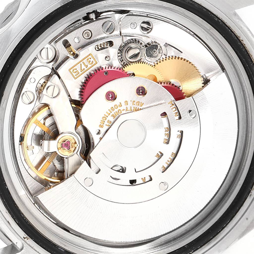 The image shows the inner mechanical movement of a Rolex GMT-Master 16700 Men's Stainless Steel Black Dial 16700 Men's Stainless Steel Black Dial watch from a rear angle, including gears and the rotor.