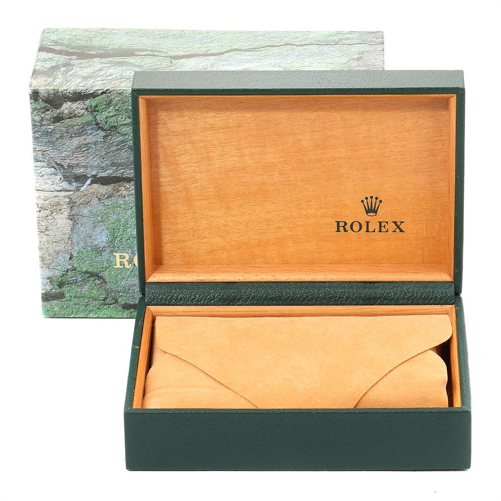 The image shows an open Rolex GMT-Master 16700 Men's Stainless Steel Black Dial 16700 Men's Stainless Steel Black Dial watch box with a green exterior and a wooden interior.