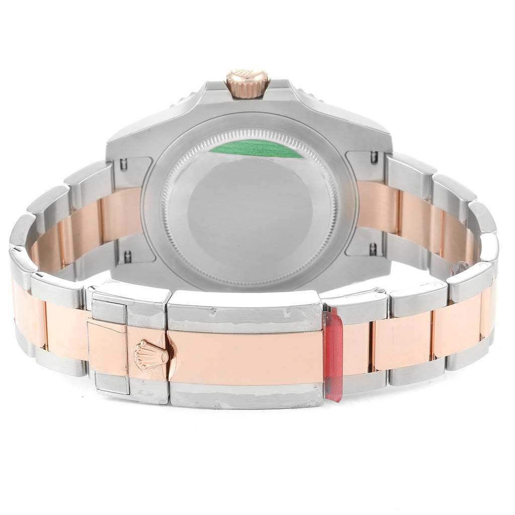 This image shows the back and clasp of a Rolex GMT-Master 126711 Men's Steel and Gold (two tone) Black Dial 126711 Men's Steel and Gold (two tone) Black Dial watch, highlighting its two-tone metal bracelet.