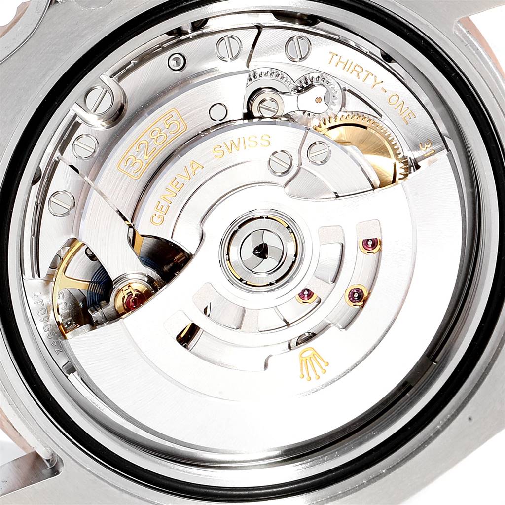 The image shows the movement mechanism of a Rolex GMT-Master 126711 Men's Steel and Gold (two tone) Black Dial 126711 Men's Steel and Gold (two tone) Black Dial, emphasizing the details of the rotor and internal components.