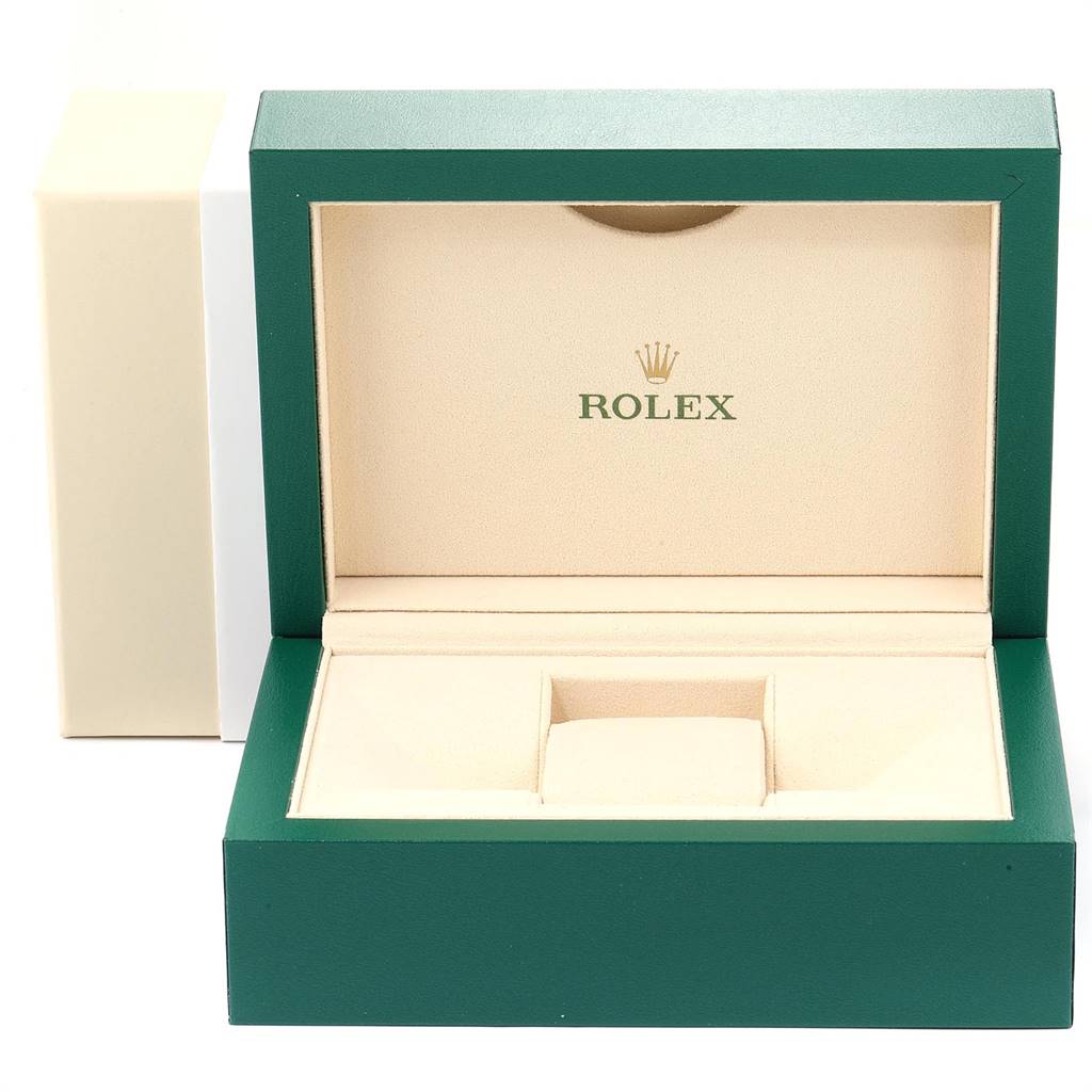The image shows an open green and beige Rolex GMT-Master 116710 Men's Stainless Steel Black Dial 116710 Men's Stainless Steel Black Dial watch box, displaying its interior.