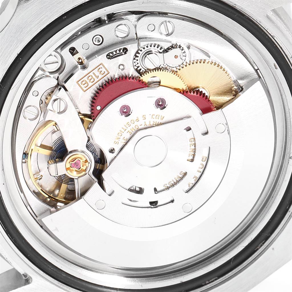 The image shows the internal mechanism and movement of a Rolex GMT-Master 116710 Men's Stainless Steel Black Dial 116710 Men's Stainless Steel Black Dial watch, including gears and the rotor.