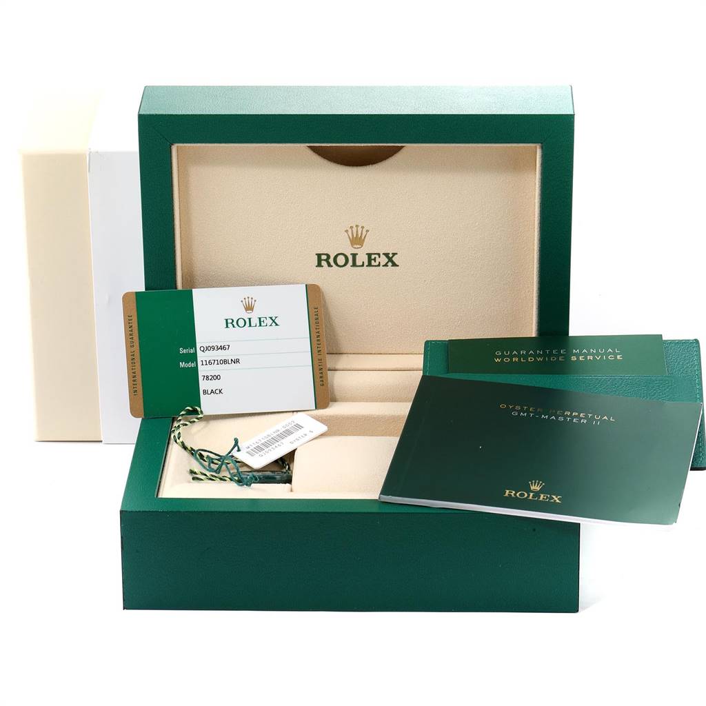 The image shows the packaging and accessories for a Rolex GMT-Master 116710 Men's Stainless Steel Black Dial 116710 Men's Stainless Steel Black Dial watch, including manuals, guarantee card, and the watch box.