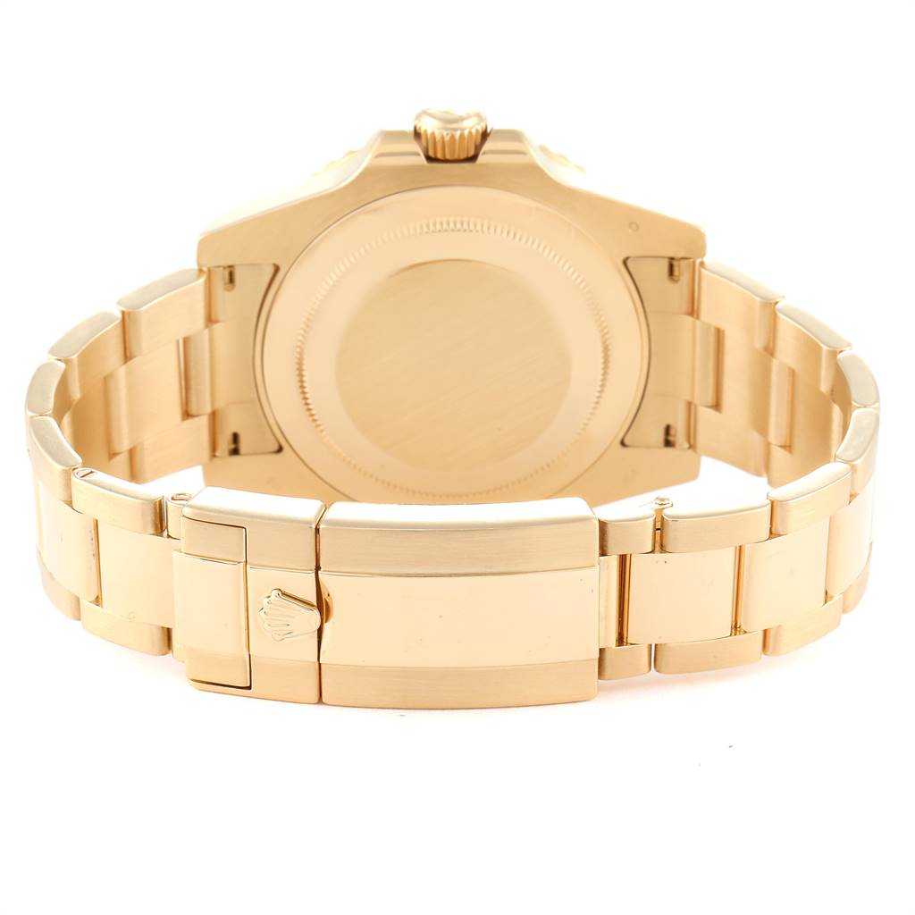 The image shows the back view of a Rolex GMT-Master 116718 Men's Yellow Gold Green Dial 116718 Men's Yellow Gold Green Dial watch, highlighting its gold case, bracelet, and clasp.