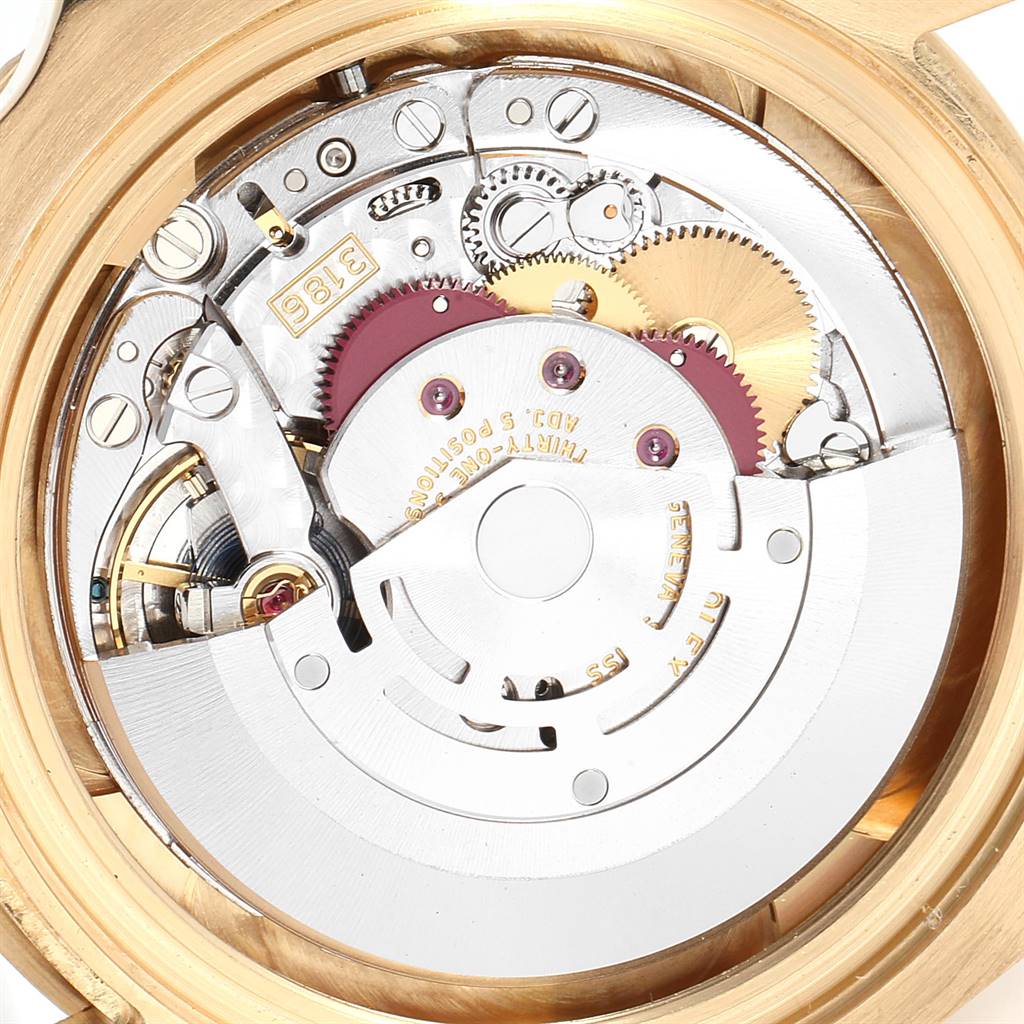 This image shows the intricate movement mechanism of a Rolex GMT-Master 116718 Men's Yellow Gold Green Dial 116718 Men's Yellow Gold Green Dial watch from a back angle.