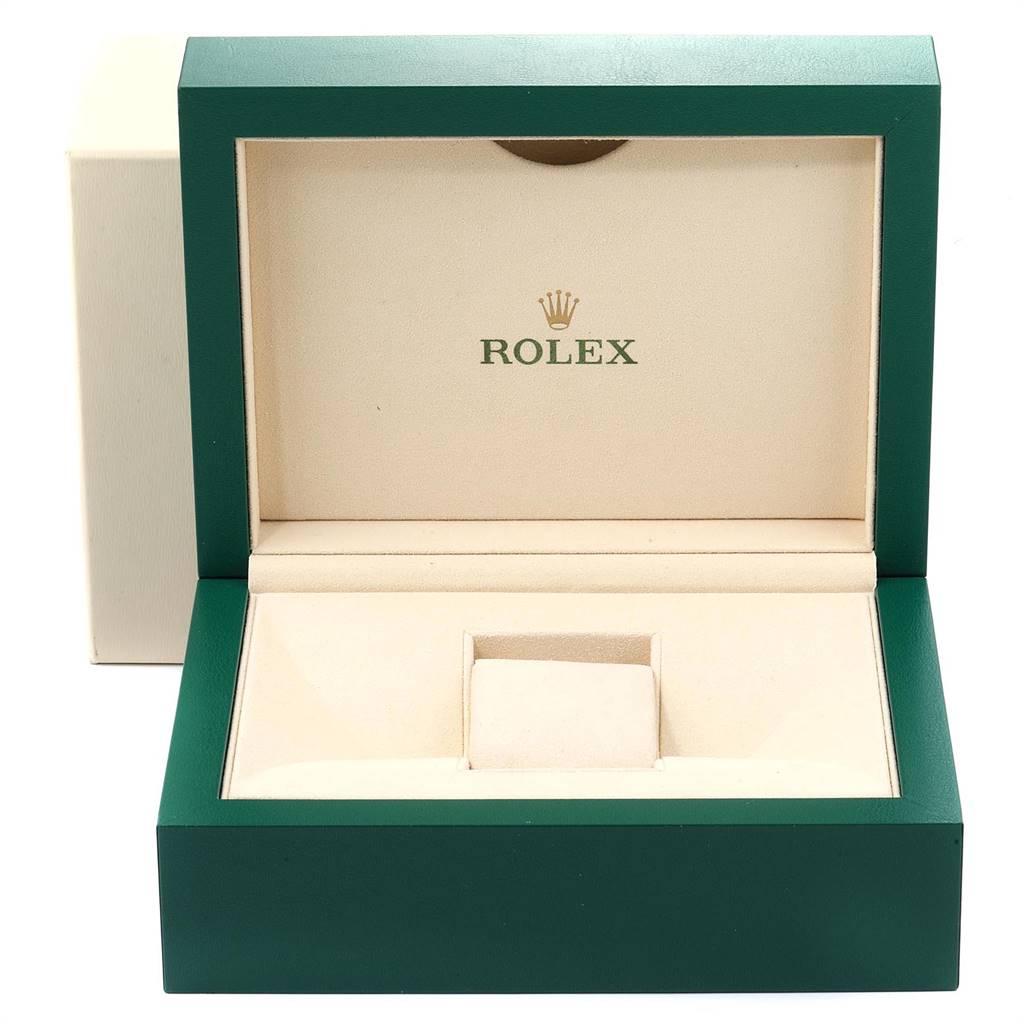 The image shows an empty green and beige Rolex box, likely for a GMT-Master model watch, viewed from the front.
