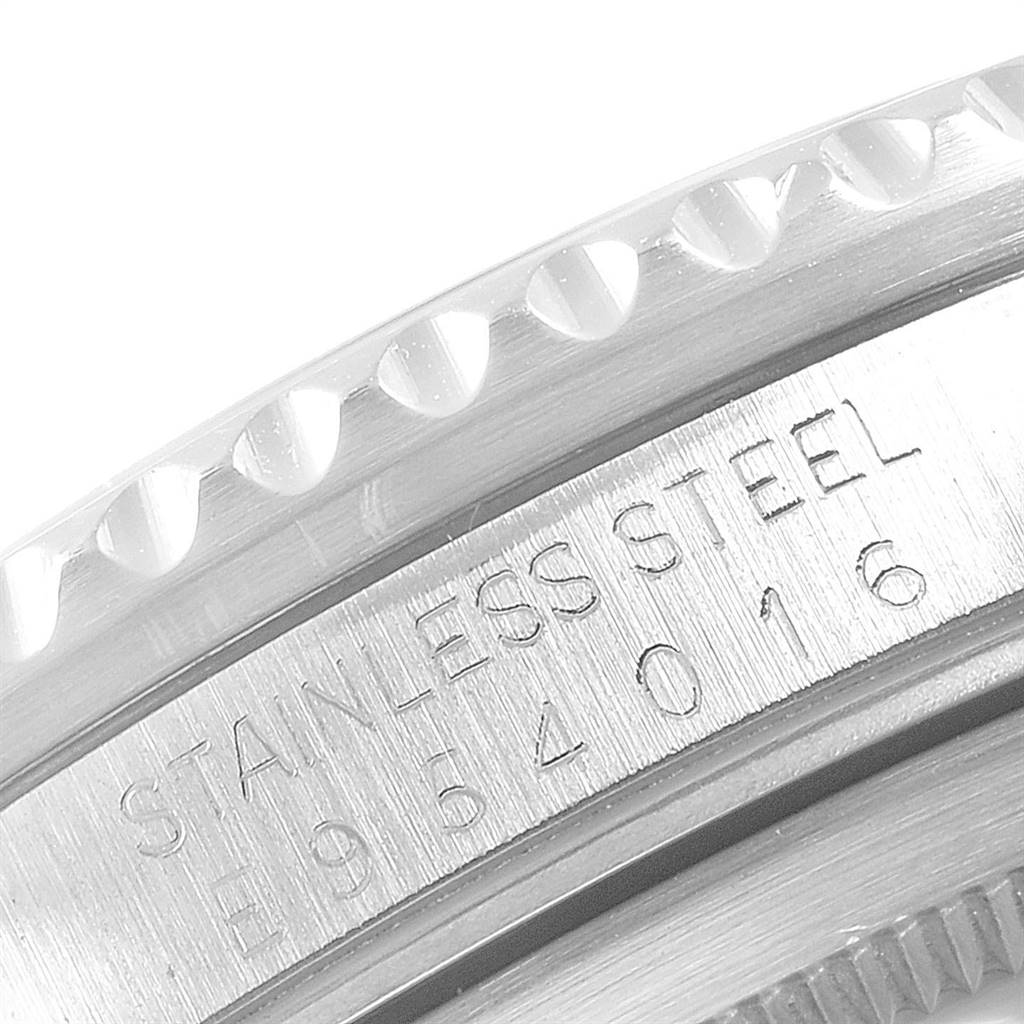 This close-up image shows the stainless steel casing and serial number of a Rolex GMT-Master 16700 Men's Stainless Steel Black Dial 16700 Men's Stainless Steel Black Dial watch.