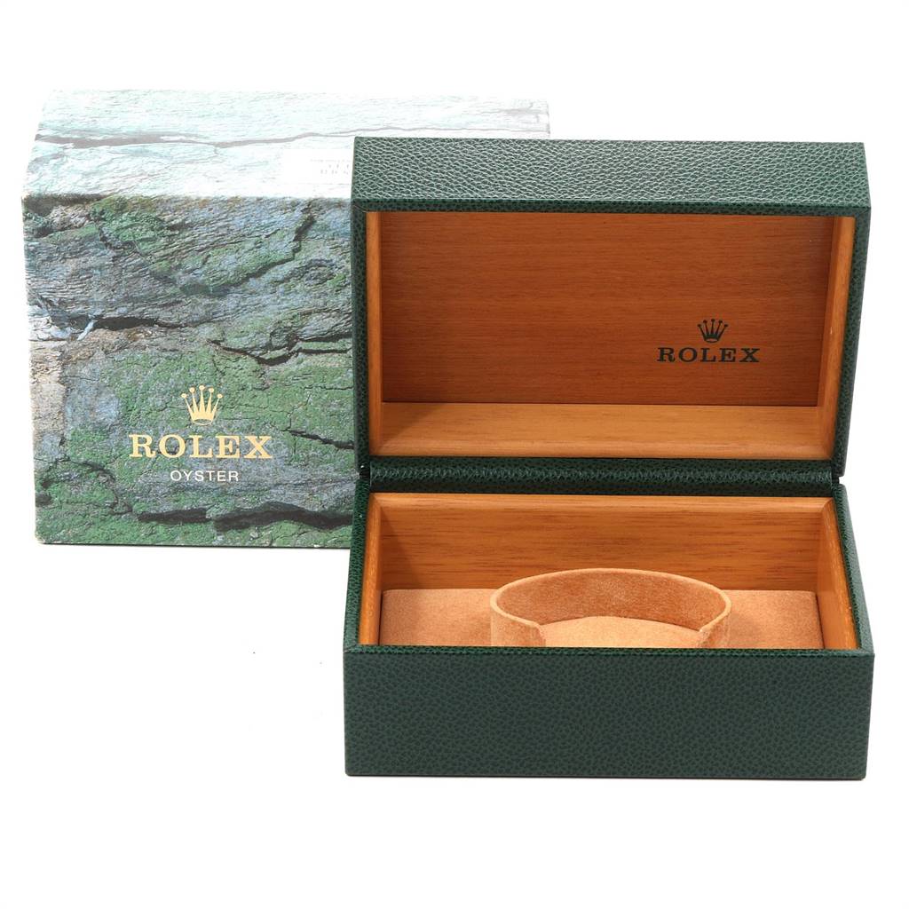 This image shows a Rolex GMT-Master 16700 Men's Stainless Steel Black Dial 16700 Men's Stainless Steel Black Dial watch box with the lid open, revealing the wooden interior and watch cushion.