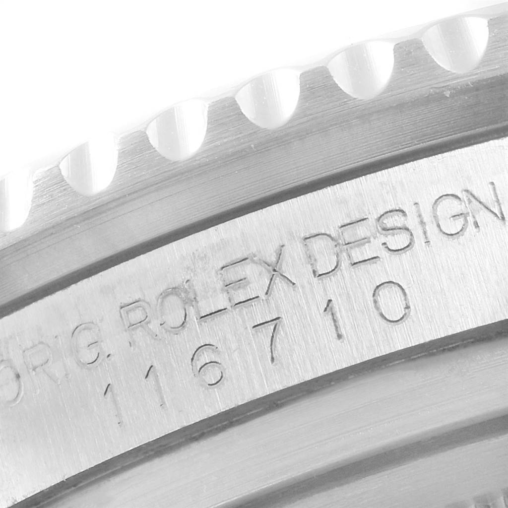 The image shows a close-up of the bezel and engraved model number "116710" on the side of a Rolex GMT-Master 116710 Men's Stainless Steel Black Dial 116710 Men's Stainless Steel Black Dial watch case.