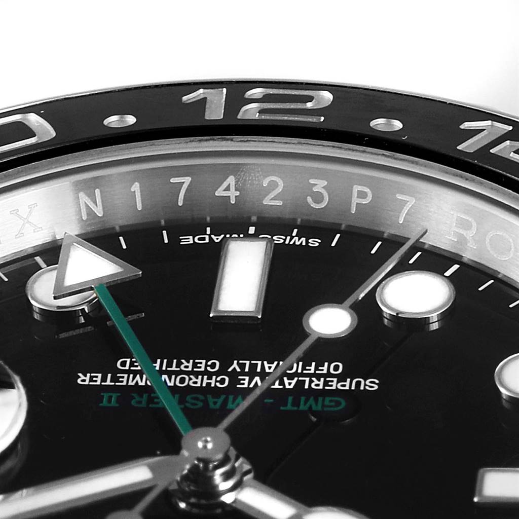 This close-up angle of the Rolex GMT-Master 116710 Men's Stainless Steel Black Dial 116710 Men's Stainless Steel Black Dial shows the bezel, hour markers, and the GMT hand on the watch face.