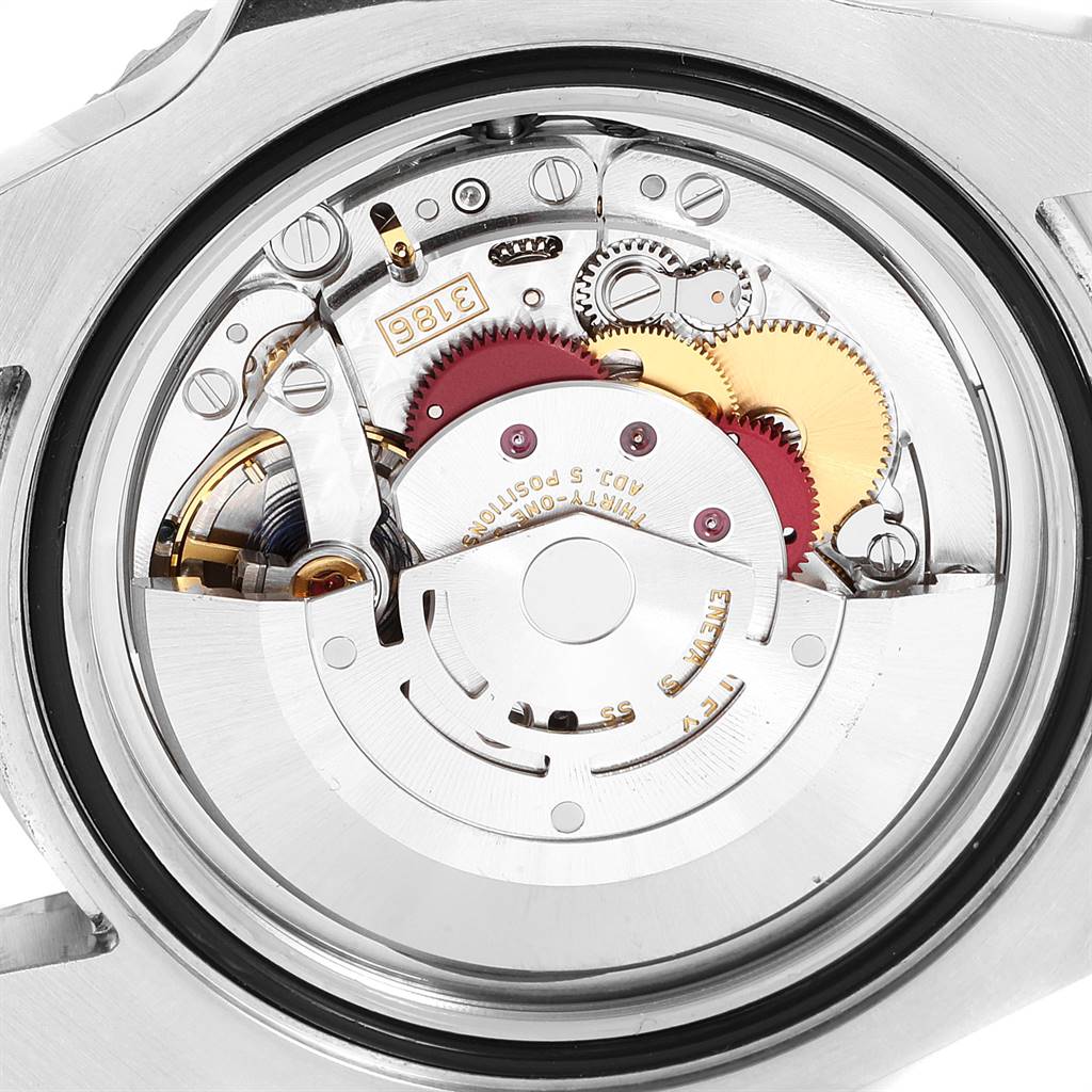 The image shows the intricate inner mechanisms and parts of a Rolex GMT-Master 116710 Men's Stainless Steel Black Dial 116710 Men's Stainless Steel Black Dial watch from a transparent case-back angle.