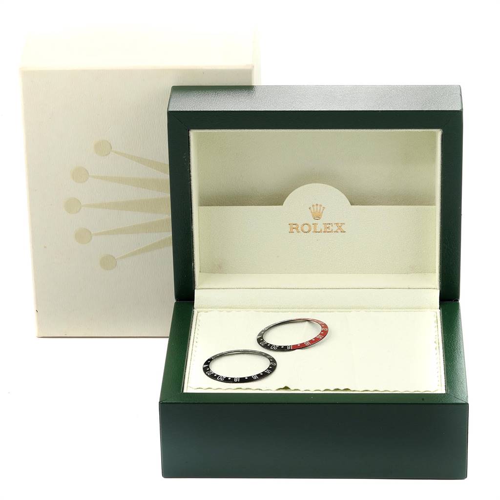 The image shows a Rolex GMT-Master 16710 Men's Stainless Steel Black Dial 16710 Men's Stainless Steel Black Dial watch box containing two bezel inserts, one black and one black-red.