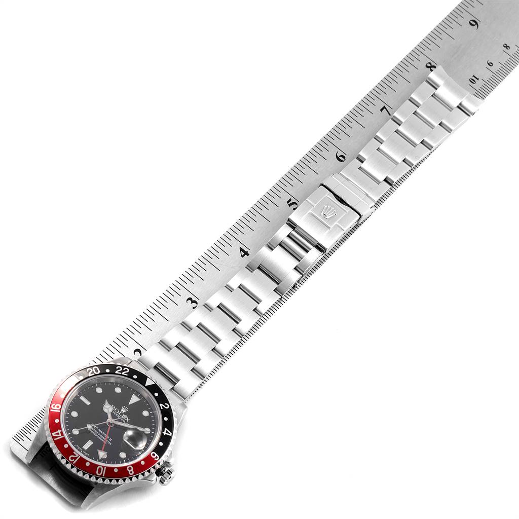 The image shows a Rolex GMT-Master 16710 Men's Stainless Steel Black Dial 16710 Men's Stainless Steel Black Dial watch placed alongside a ruler, with the focus on the bracelet and bezel.