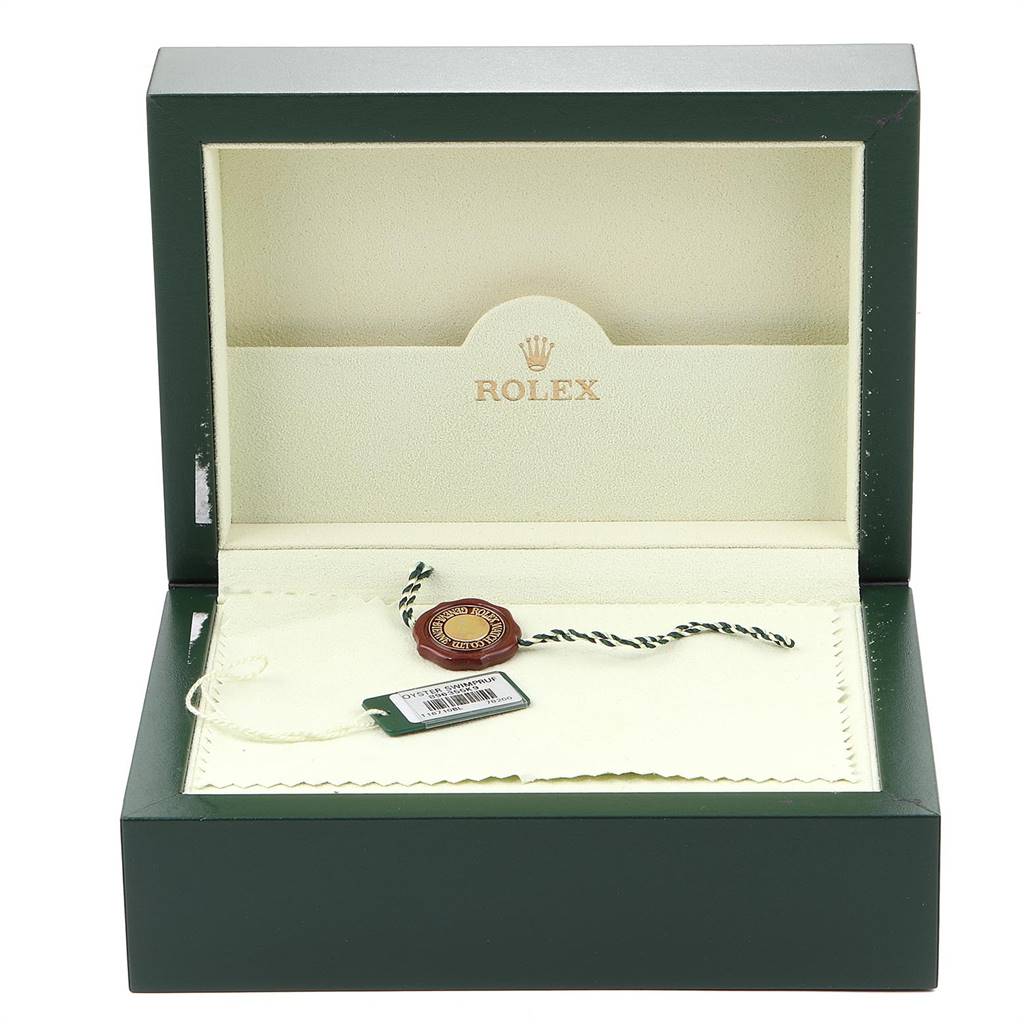 The image shows the open box of a Rolex GMT-Master 16710 Men's Stainless Steel Black Dial 16710 Men's Stainless Steel Black Dial, displaying tags, a seal, and a cloth inside.