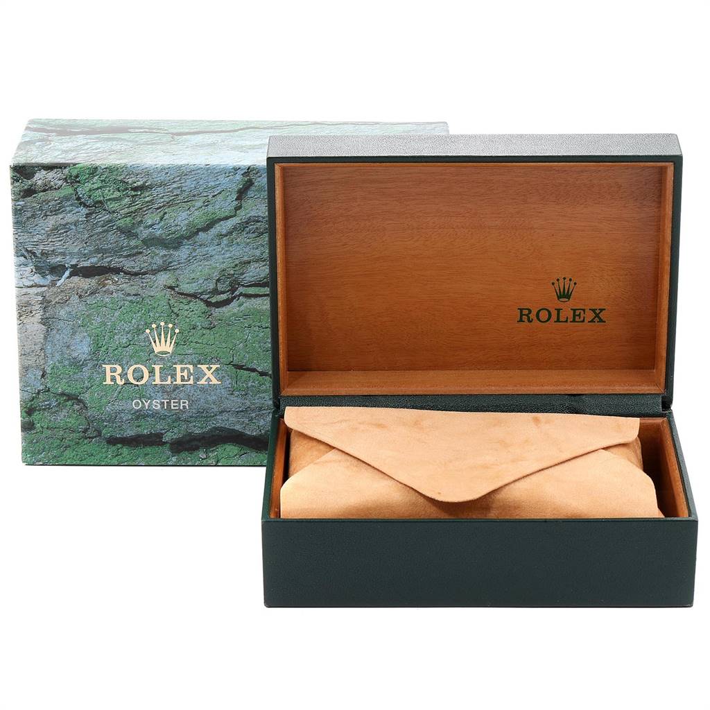 The image shows an open box for the Rolex GMT-Master 16710 Men
s Stainless Steel Black Dial 16710 Men
s Stainless Steel Black Dial watch, with a green outer box and a wooden inner box.