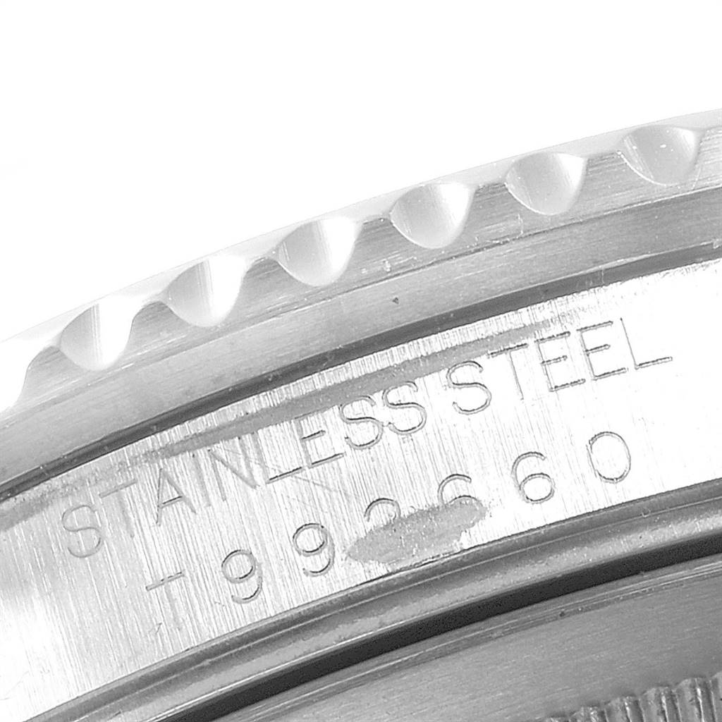 The image shows a close-up of the bezel and case back of a Rolex GMT-Master 16700 Men's Stainless Steel Black Dial 16700 Men's Stainless Steel Black Dial watch, displaying "STAINLESS STEEL" and the serial number.