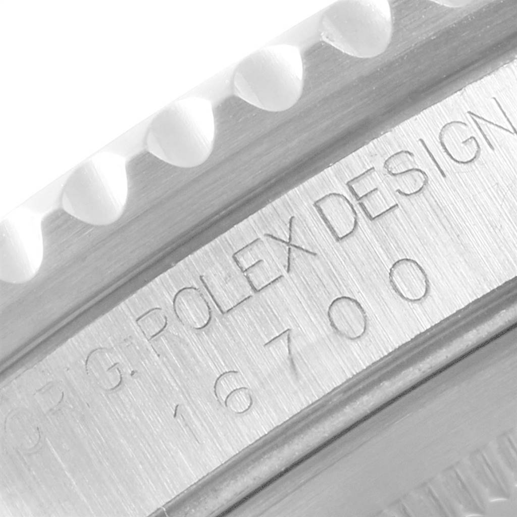 This close-up image shows the bezel and engraved side of the case of a Rolex GMT-Master 16700 Men's Stainless Steel Black Dial 16700 Men's Stainless Steel Black Dial watch.