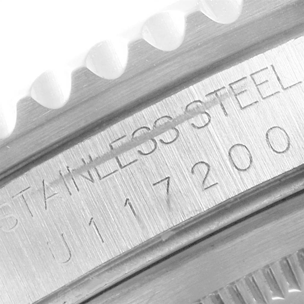 This is a close-up of the engraved side of a Rolex GMT-Master 16700 Men's Stainless Steel Black Dial 16700 Men's Stainless Steel Black Dial watch, showing part of the bezel and case inscriptions.