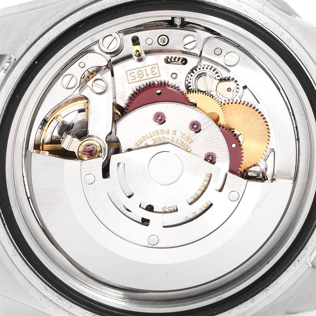 This is an internal view of the Rolex GMT-Master 16710 Men's Stainless Steel Black Dial 16710 Men's Stainless Steel Black Dial watch, showcasing the intricate movement and gears.