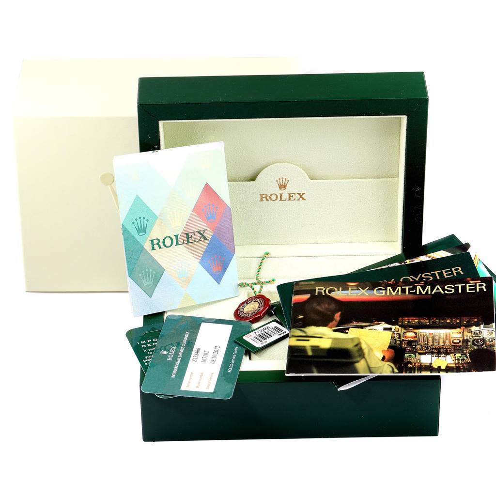 The image shows a Rolex GMT-Master 16710 Men's Stainless Steel Black Dial 16710 Men's Stainless Steel Black Dial watch box, manuals, warranty card, and tags from a front angle.