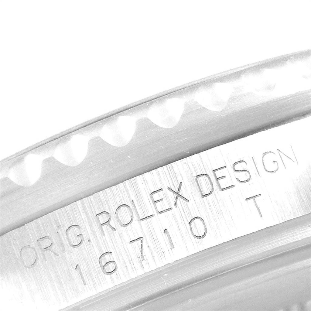 The image shows the engraved serial number and design detail on the case of a Rolex GMT-Master 16710 Men's Stainless Steel Black Dial 16710 Men's Stainless Steel Black Dial model 16710 T.