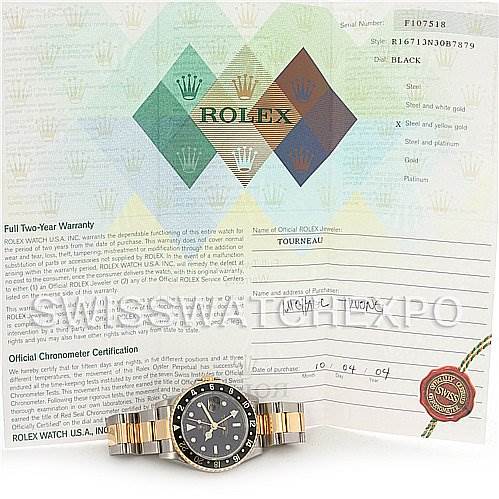 The image shows a Rolex GMT-Master 16713 Men's Stainless Steel Black Dial 16713 Men's Stainless Steel Black Dial watch lying flat with its band extended in front of its warranty certificate and chronometer certification.