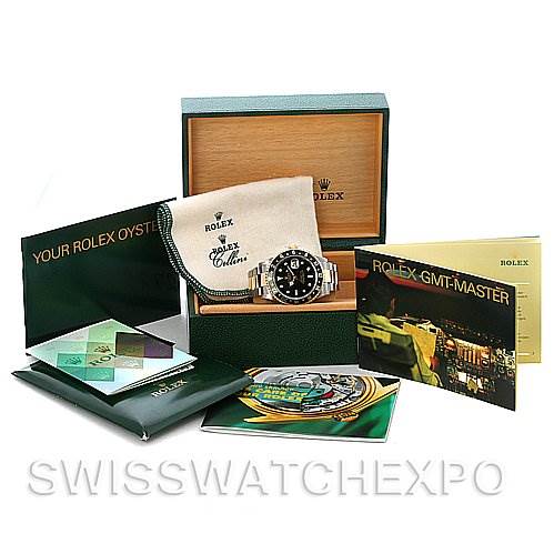 The image shows a Rolex GMT-Master 16713 Men's Stainless Steel Black Dial 16713 Men's Stainless Steel Black Dial watch, box, manuals, and accessories including a cloth, all displayed from a front angle.