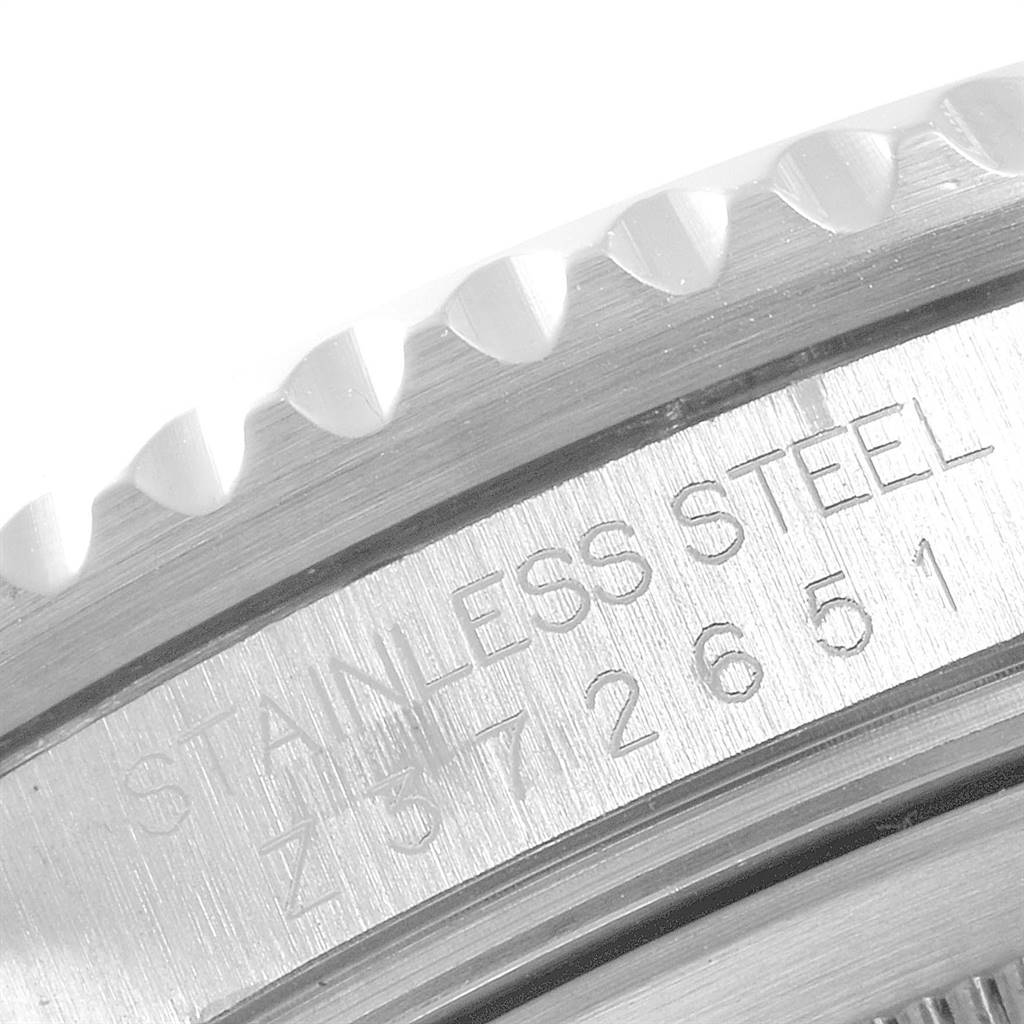 The image shows a close-up of the stainless steel case back and part of the bezel of a Rolex GMT-Master 16710 Men's Stainless Steel Black Dial 16710 Men's Stainless Steel Black Dial.