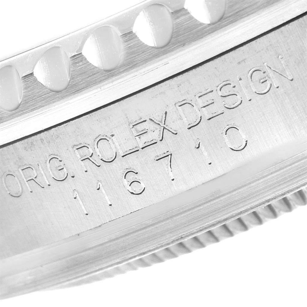 This image shows a close-up of the side engraving on the case of a Rolex GMT-Master 116710 Men's Stainless Steel Black Dial 116710 Men's Stainless Steel Black Dial watch.