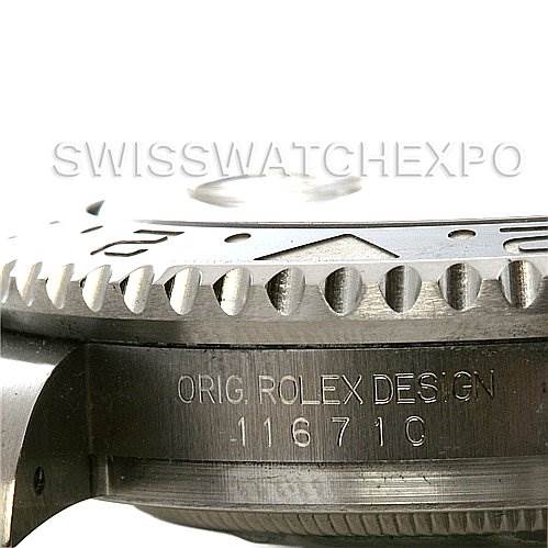 This close-up image shows the side profile of a Rolex GMT-Master 116710 Men's Stainless Steel Black Dial 116710 Men's Stainless Steel Black Dial watch bezel and the engraved serial number on the case.