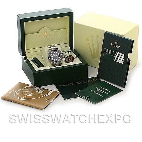 The image shows a Rolex GMT-Master 116710 Men's Stainless Steel Black Dial 116710 Men's Stainless Steel Black Dial watch with its box, warranty card, manual, and additional booklets.