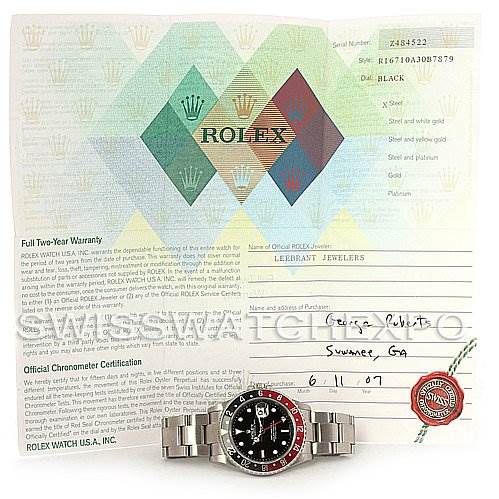 The image shows a front view of the Rolex GMT-Master 16710 Men's Stainless Steel Black Dial 16710 Men's Stainless Steel Black Dial watch with a partially visible certification and warranty paper in the background.