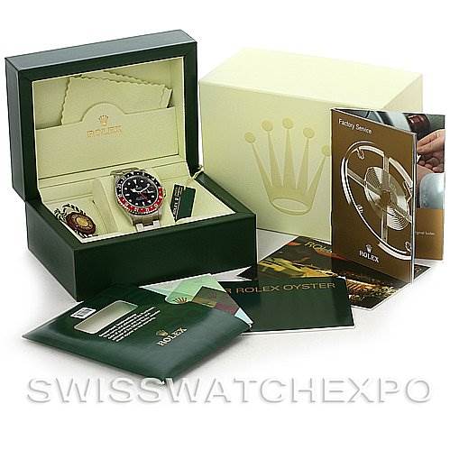 The image shows a Rolex GMT-Master 16710 Men's Stainless Steel Black Dial 16710 Men's Stainless Steel Black Dial watch and accessories, including its box, manuals, and tags, displayed at an angled view.