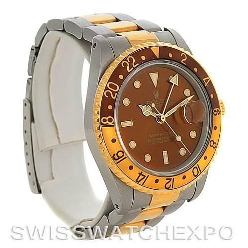 This image shows a side angle of a Rolex GMT-Master 16713 Men's Stainless Steel Brown Dial 16713 Men's Stainless Steel Brown Dial watch, highlighting its brown and gold bezel and two-tone bracelet.