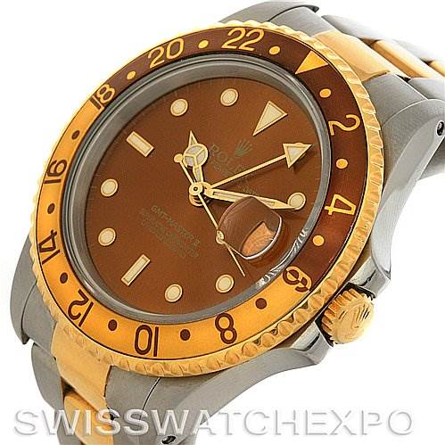 This image shows a Rolex GMT-Master 16713 Men's Stainless Steel Brown Dial 16713 Men's Stainless Steel Brown Dial watch at an angled view, highlighting the bezel, dial, crown, and part of the bracelet.