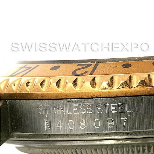 The image shows a close-up side view of a Rolex GMT-Master 16713 Men's Stainless Steel Brown Dial 16713 Men's Stainless Steel Brown Dial watch, highlighting the bezel and part of the case with an engraved serial number.
