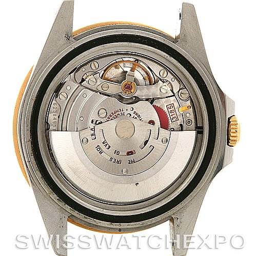 The image shows the back of a Rolex GMT-Master 16713 Men's Stainless Steel Brown Dial 16713 Men's Stainless Steel Brown Dial watch with its case removed, revealing the movement and mechanism inside.