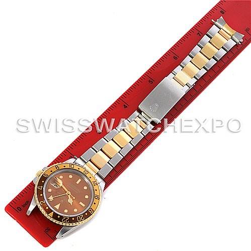 The image shows the full length of a Rolex GMT-Master 16713 Men's Stainless Steel Brown Dial 16713 Men's Stainless Steel Brown Dial watch, including the dial, bezel, and bracelet, alongside a red ruler.